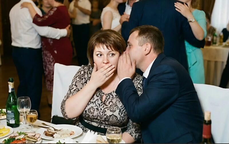 At the wedding, my sister seated me in the farthest corner, but suddenly a stranger leaned toward me and quietly said, “Pretend we’re a couple — and your sister will seriously regret it”